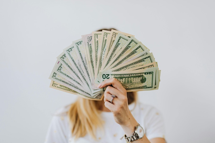 Female holding money